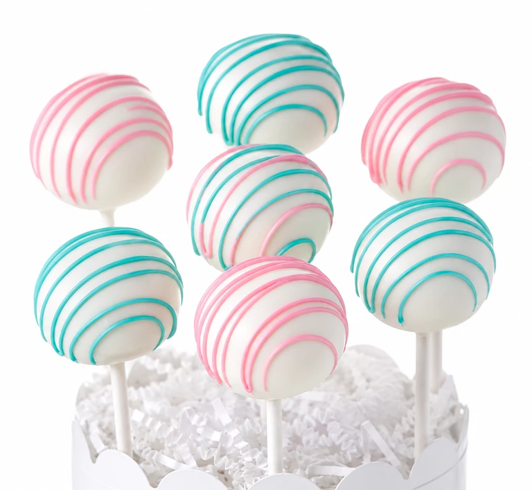 Cake pops with pink and blue swirls.
